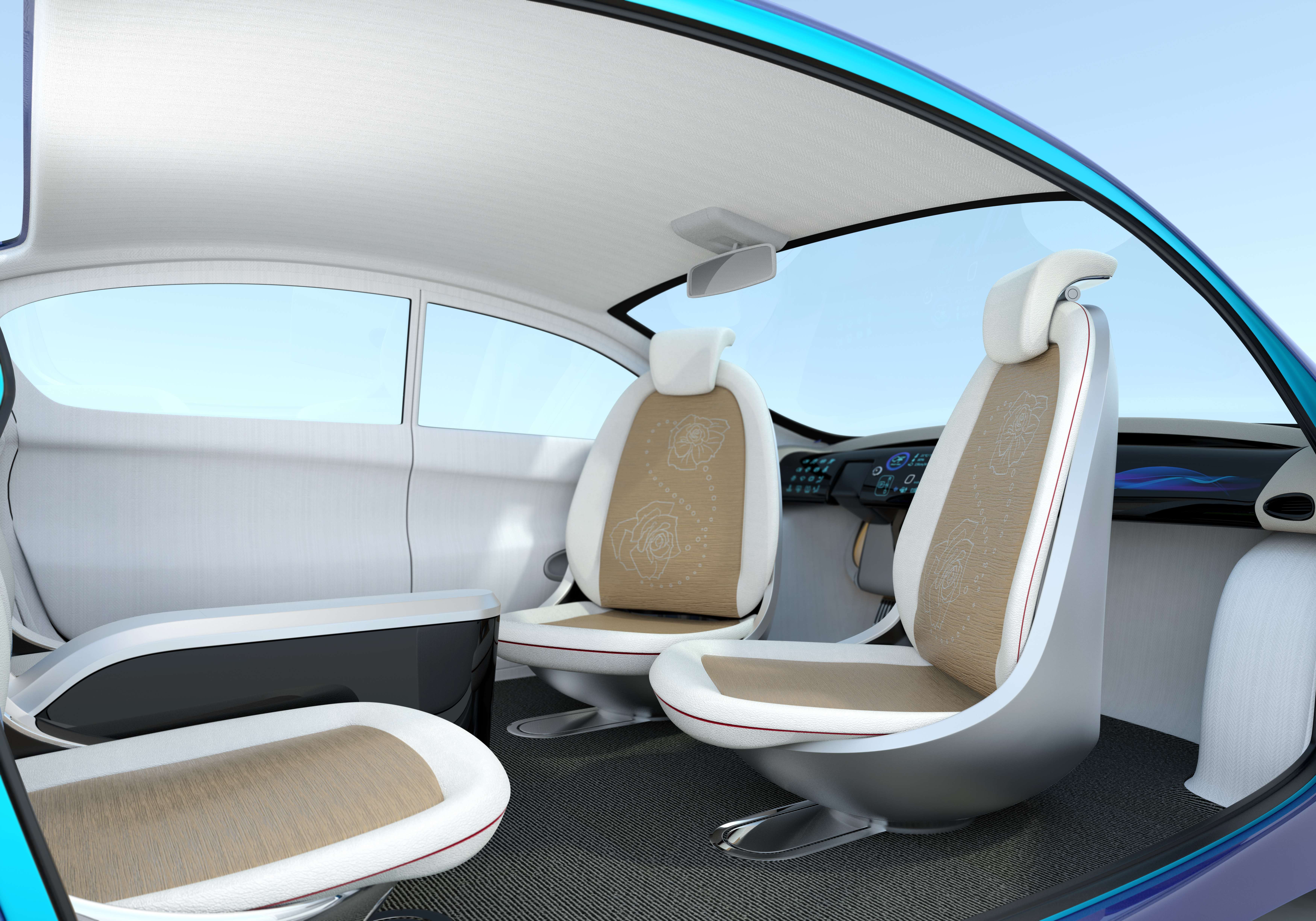 Blick in das Innere eines autonom fahrenden Automobils mit hellen Sitzen.